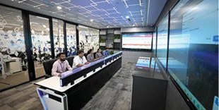 Operators at the APSEZ command centre console