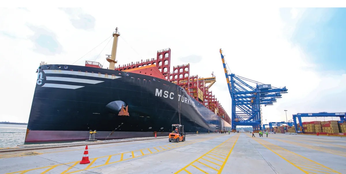 A large container vessel berthed at an APSEZ terminal